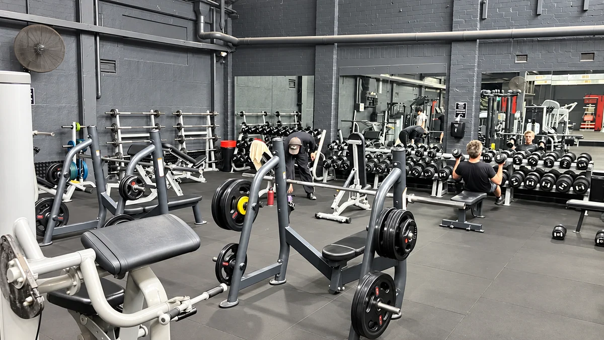 Strength machines and dumbbells at Top Gym Brunswick