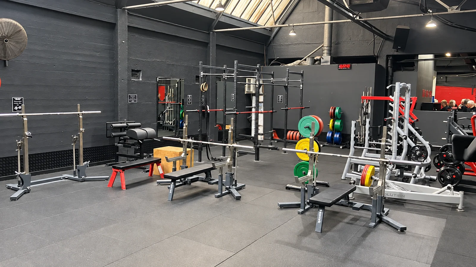 Squat racks and free-weight training area at Top Gym Brunswick