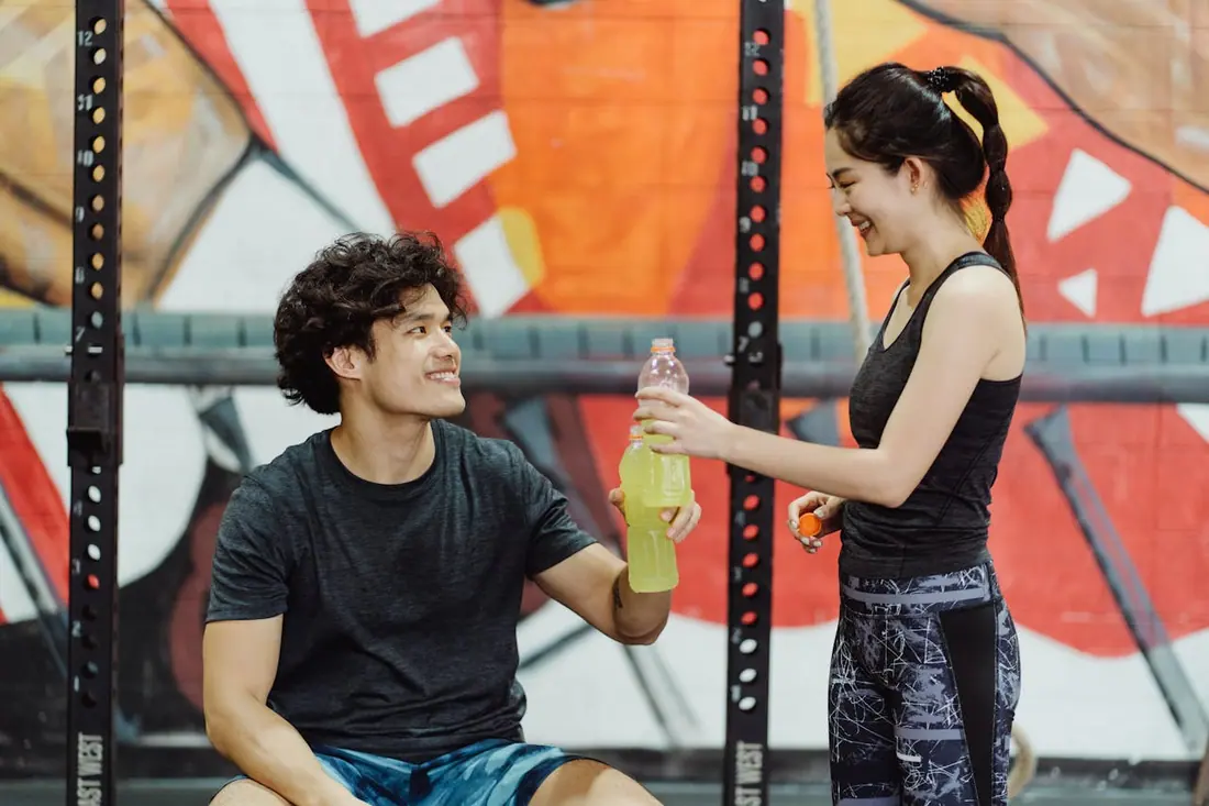 gym buddies having a water break