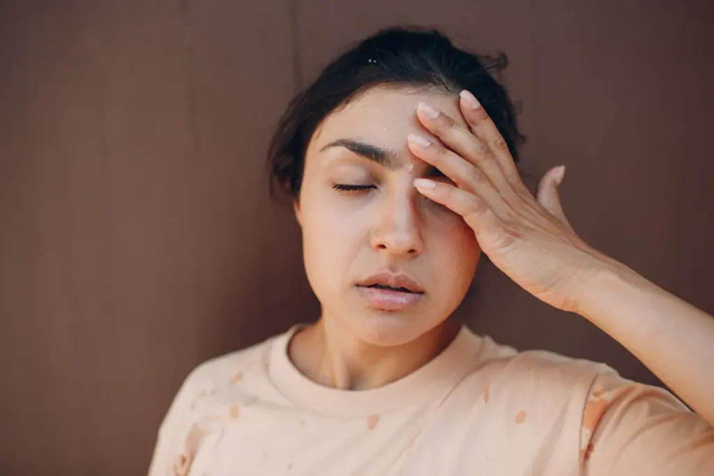 Person experiencing a dehydration headache
