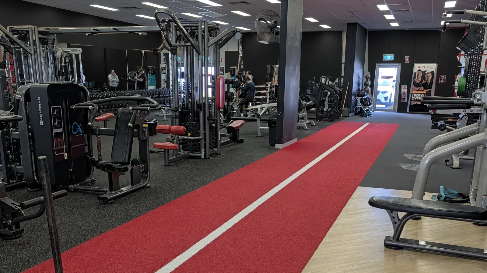 Weights, strength machines and the red training track at Top Gym Knoxfield