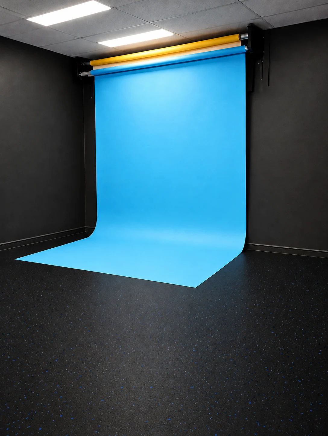 Blue backdrop lowered in the studio — retouched visual preview
