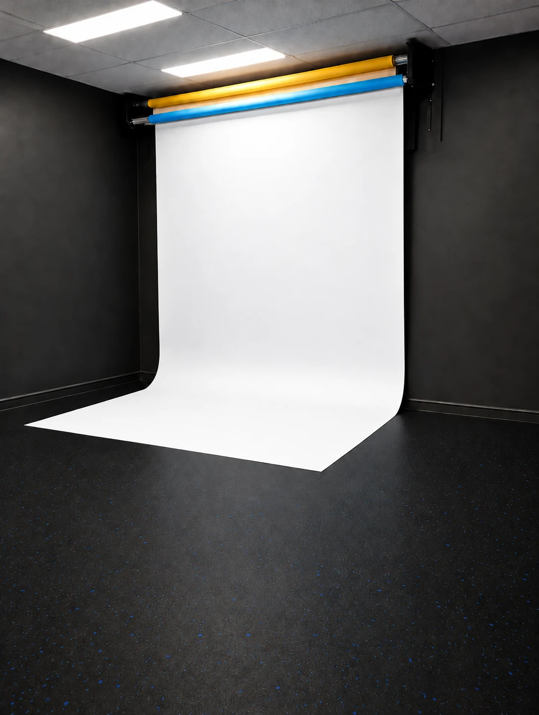 White backdrop lowered in the studio — retouched visual preview